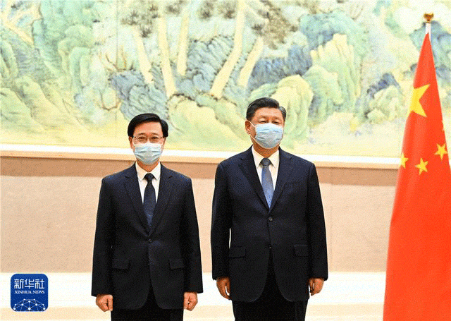 习近平会见李家超